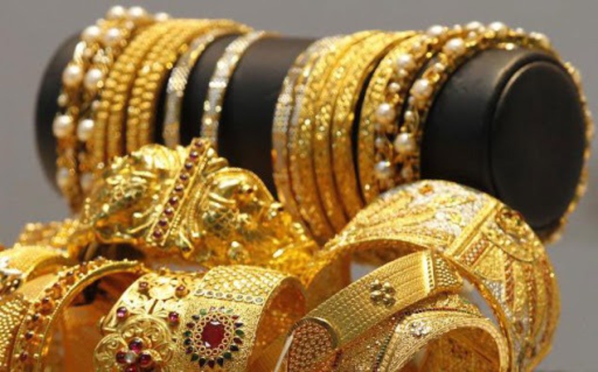 A stack of intricately patterned gold bangles and kadas at Lakshmis Jewellers, East Ham