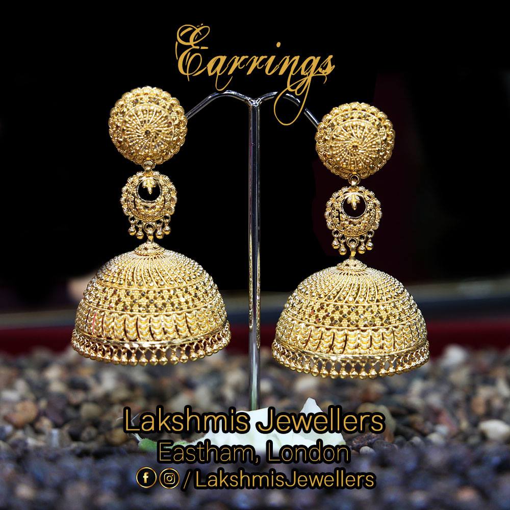 A pair of large traditional gold jhumka earrings at Lakshmis Jewellers, East Ham